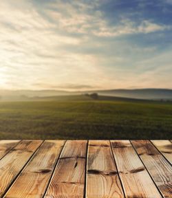 Scenic view of field against sky during sunset