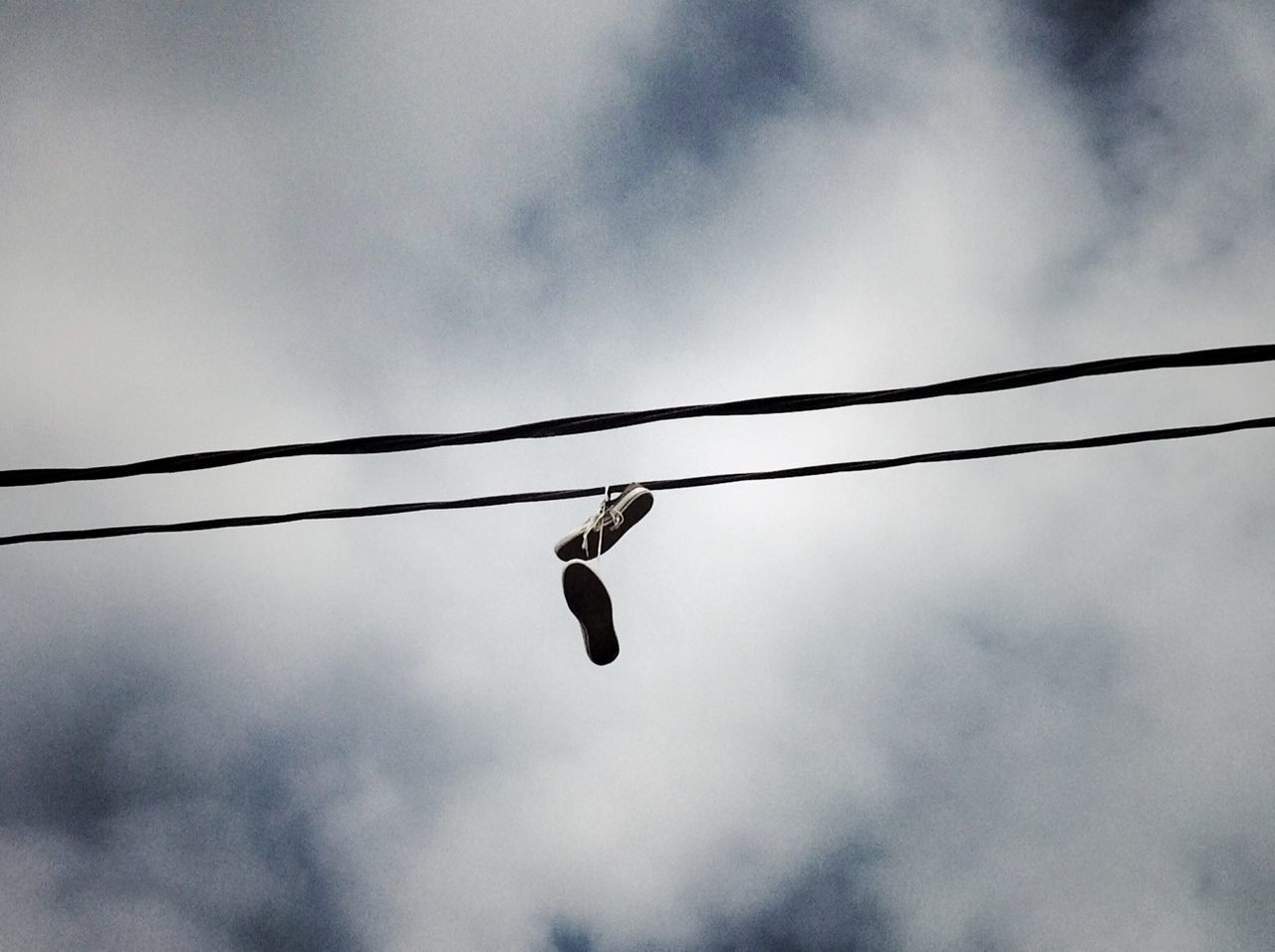 low angle view, sky, cloud - sky, cloudy, cable, hanging, cloud, safety, outdoors, no people, power line, rope, perching, day, bird, silhouette, protection, connection, nature, pole