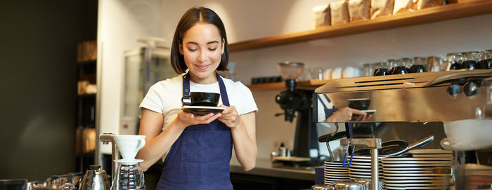 Portrait of young woman using mobile phone