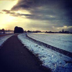 View of road against cloudy sky