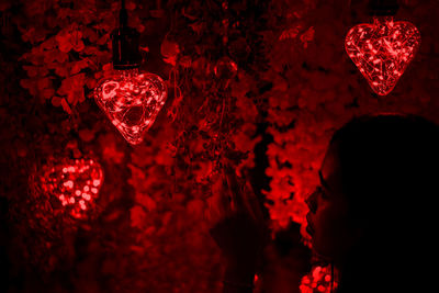 Close-up of woman holding heart shape decoration