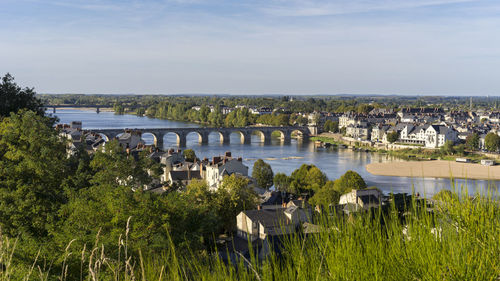 High angle view of bridge over river against buildings