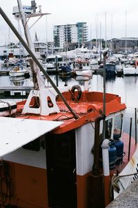 Boats moored at harbor