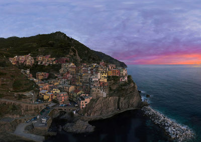 Drone image of the beautiful world heritage village of manarola at sunset.
