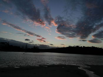 Scenic view of lake against sky during sunset