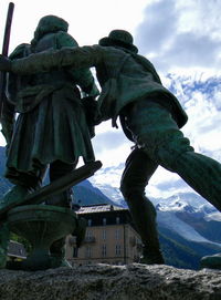 Low angle view of statue against sky