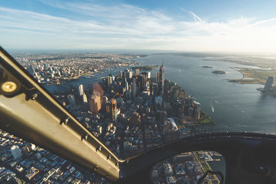 High angle view of cityscape against cloudy sky