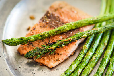 Close-up of fish on barbecue grill