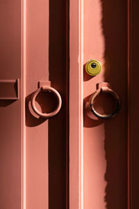 Background wooden coral door with metal rings closeup