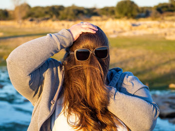 Rear view of woman wearing sunglasses