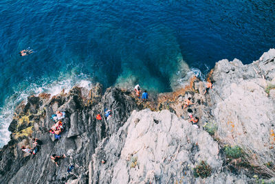 High angle view of rocks in sea