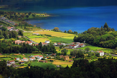 High angle view of houses on field against sky