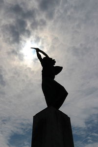 Low angle view of statue against sky