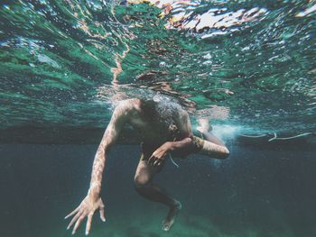 Man swimming in sea