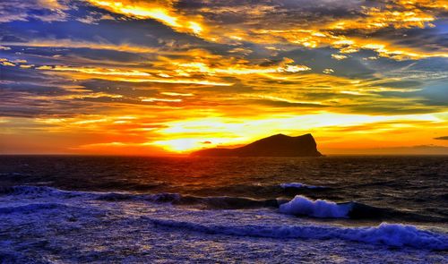 Scenic view of sea at sunset