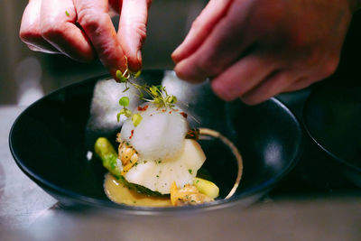 Close-up of hand holding ice cream