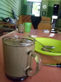 Close-up of coffee cup on table