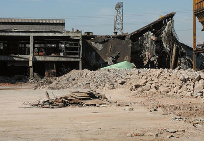 Stack of logs by building against sky