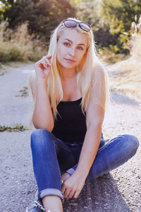 Portrait of teenage girl sitting outdoors