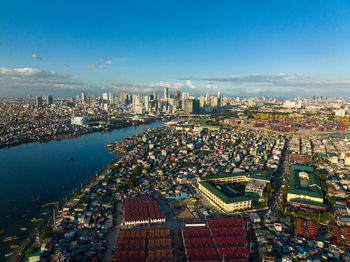 Top view of panorama of the city of manila with skyscrapers and the port area.