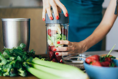 Midsection of man preparing food