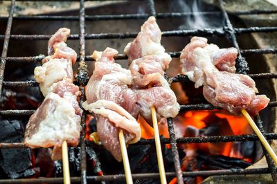 Close-up of meat on barbecue grill