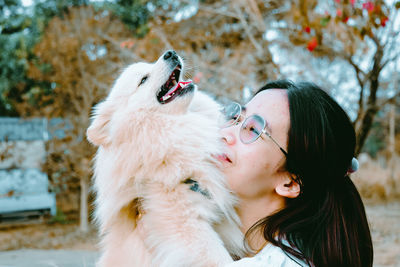 Close-up of woman with dog