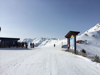 View of ski lift on snowcapped mountain