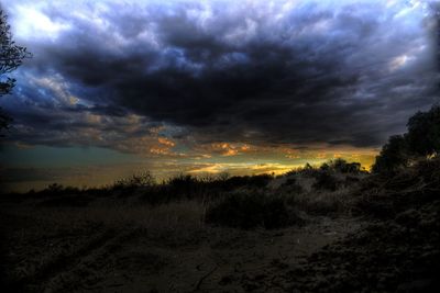 Scenic view of dramatic sky over beach