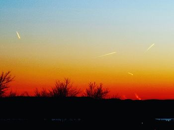 Scenic view of silhouette landscape against romantic sky at sunset