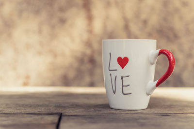 Close-up of coffee cup on table