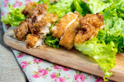 Close-up of fried chicken with lettuce