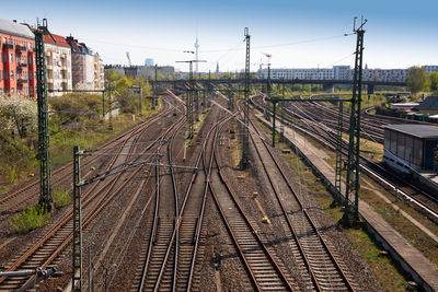 Railroad tracks amidst train against sky