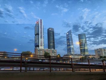 Modern buildings in city against sky