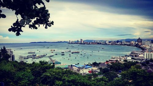 High angle view of city against cloudy sky