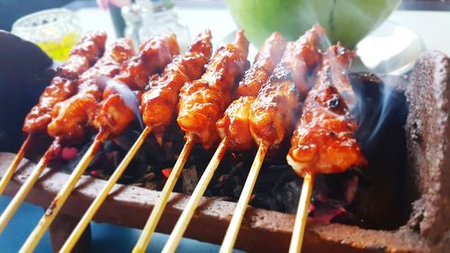 Close-up of meat on barbecue grill