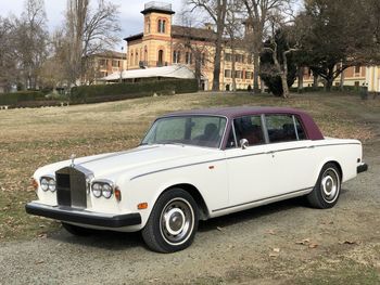 Vintage car parked outside building