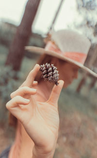 Close-up of hand holding fruit