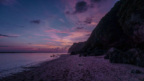 Sunset behind the rock cliff