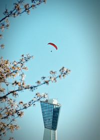 Air traffic control tower against clear sky