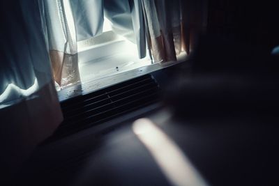 Close-up of curtain on window at home