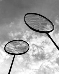 Low angle view of badminton racket against sky