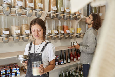 Woman shopping in packaging-free supermarket