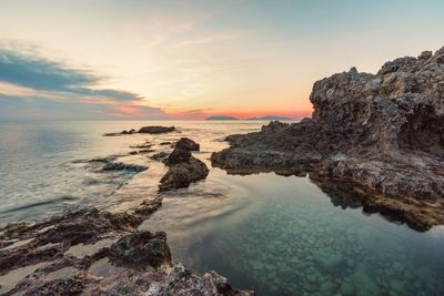 Scenic view of sea against sky at sunset