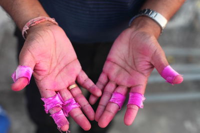 Manual worker showing stained hands