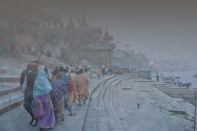 Group of people walking in front of building