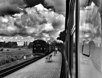 Train in city against sky