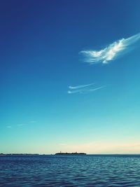 Scenic view of sea against blue sky