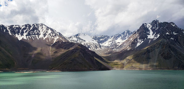 Scenic view of snowcapped mountains against sky during winter