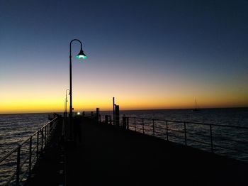 Scenic view of sea against clear sky during sunset